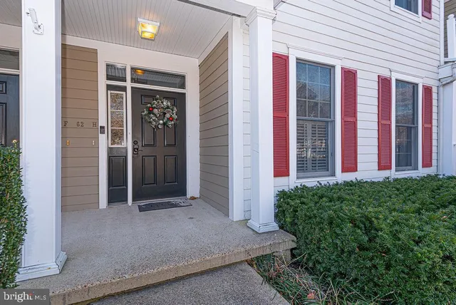 front view of a brick house with a large windows