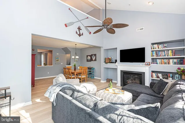 a living room with fireplace furniture and a flat screen tv