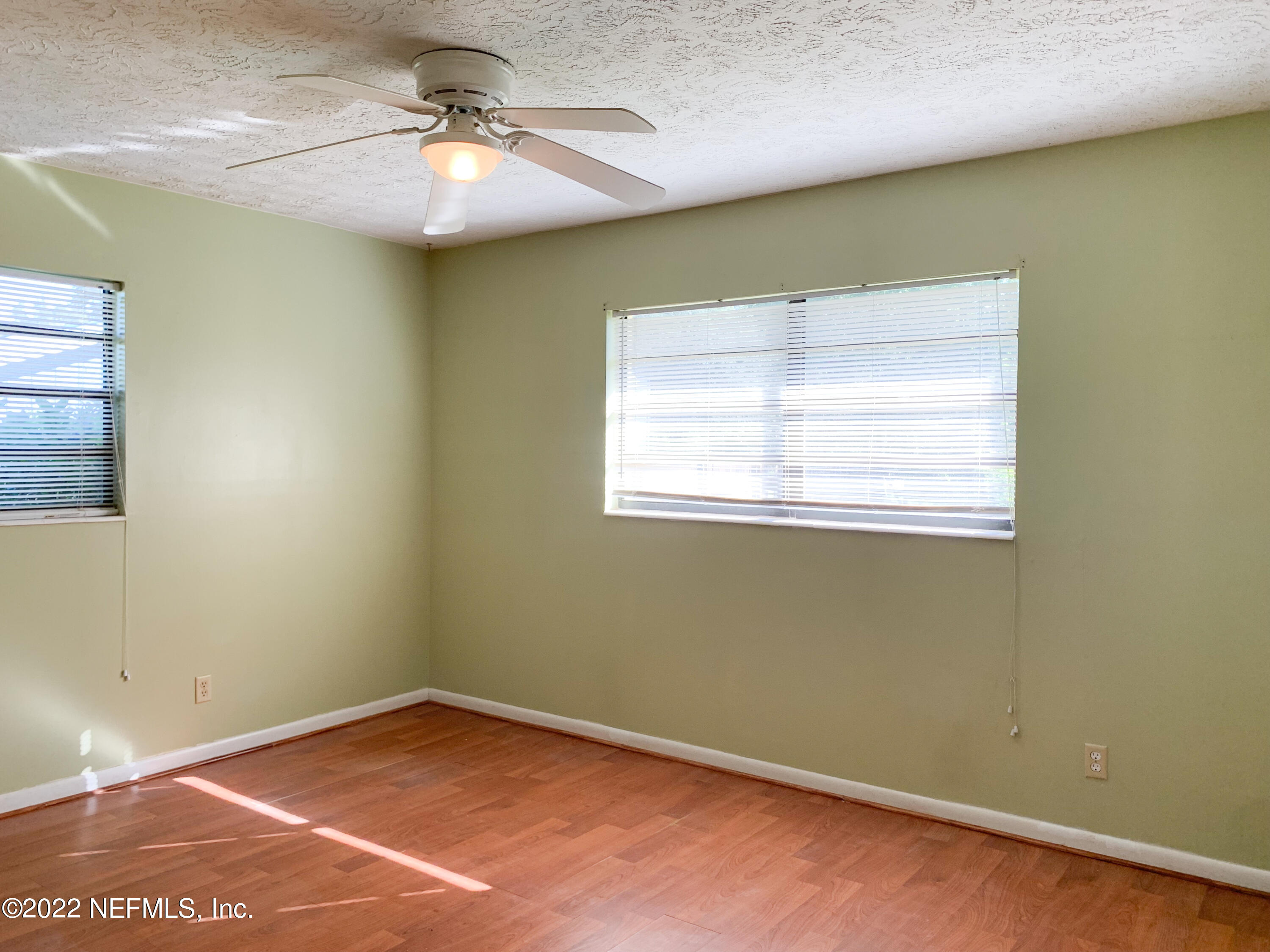 6771 Deer Springs Road Keystone Heights, FL 32656 - Photo 14 of 23 an empty room with a window and a ceiling fan
