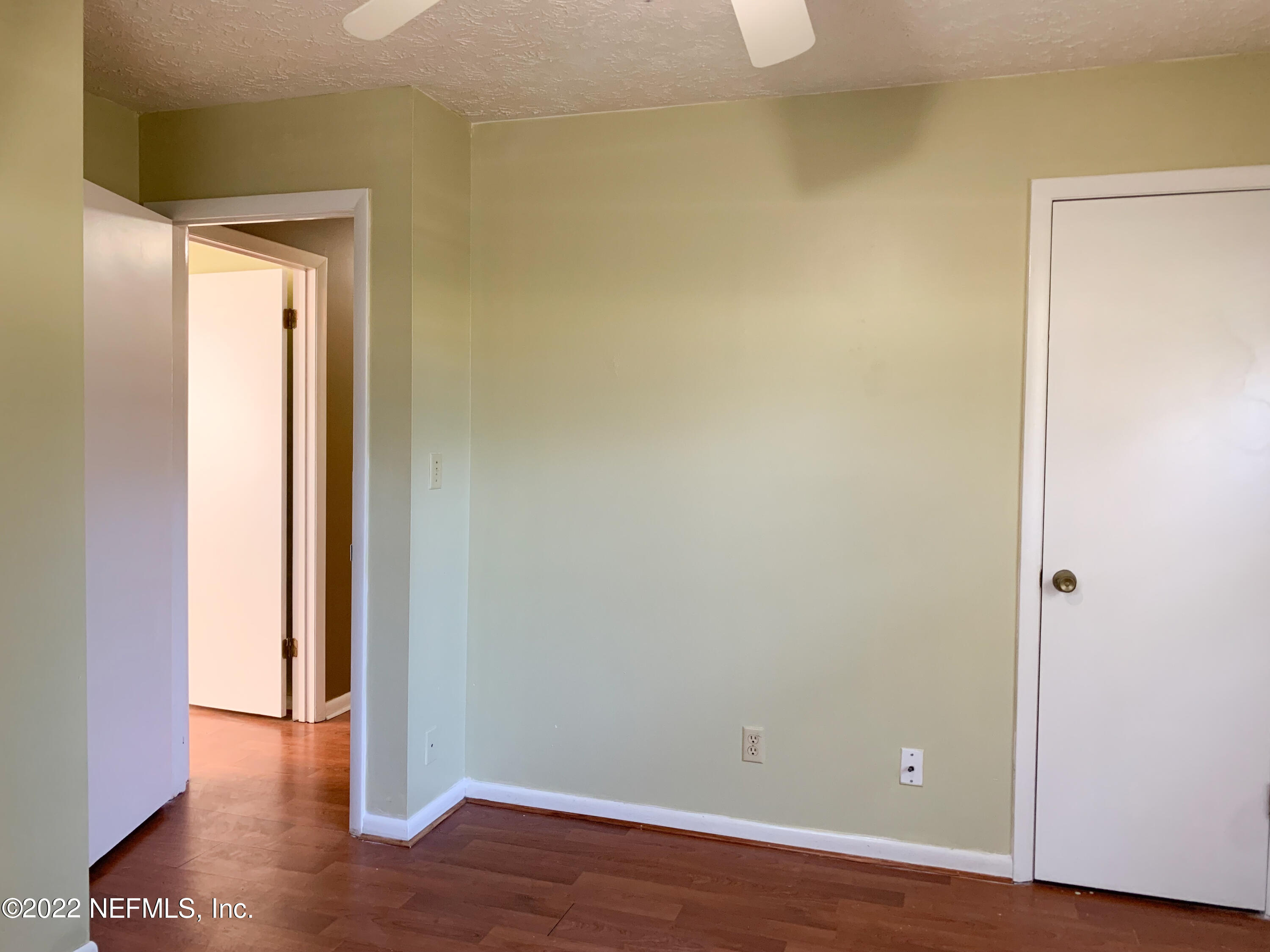 6771 Deer Springs Road Keystone Heights, FL 32656 - Photo 15 of 23 a view of an empty room with wooden floor