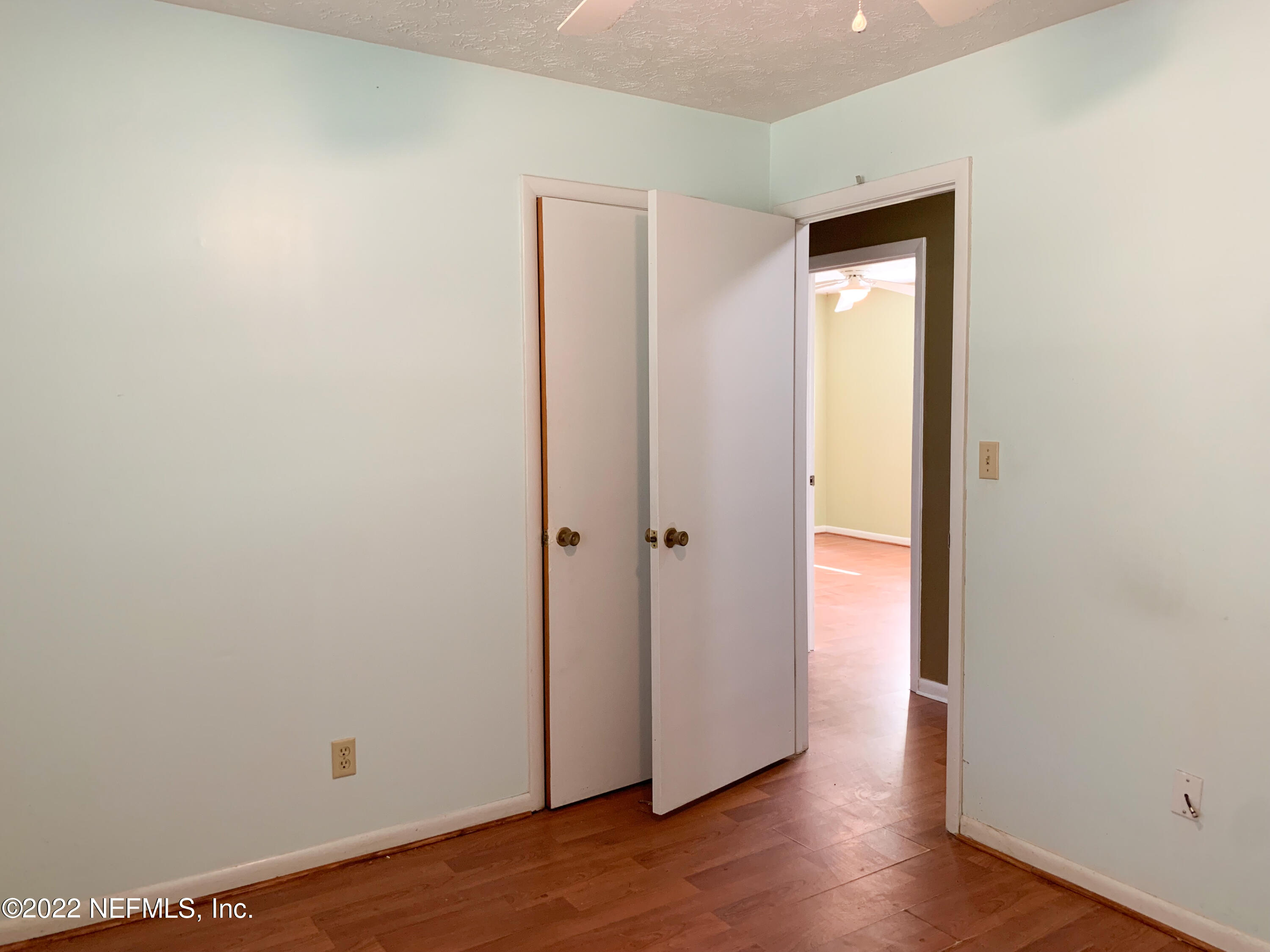 6771 Deer Springs Road Keystone Heights, FL 32656 - Photo 16 of 23 a view of an empty room with wooden floor