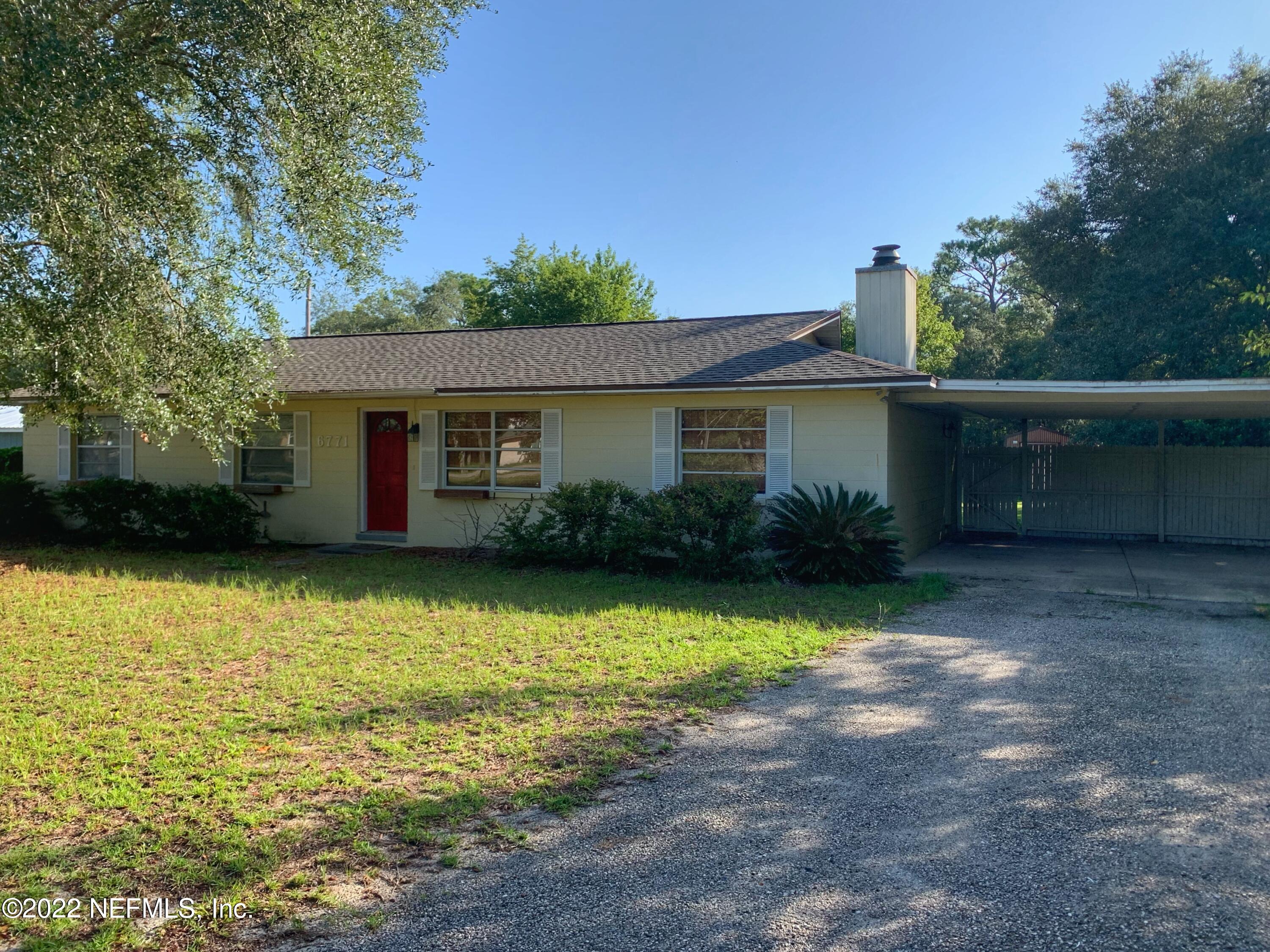 6771 Deer Springs Road Keystone Heights, FL 32656 - Photo 2 of 23 a view of a house with pool and a yard