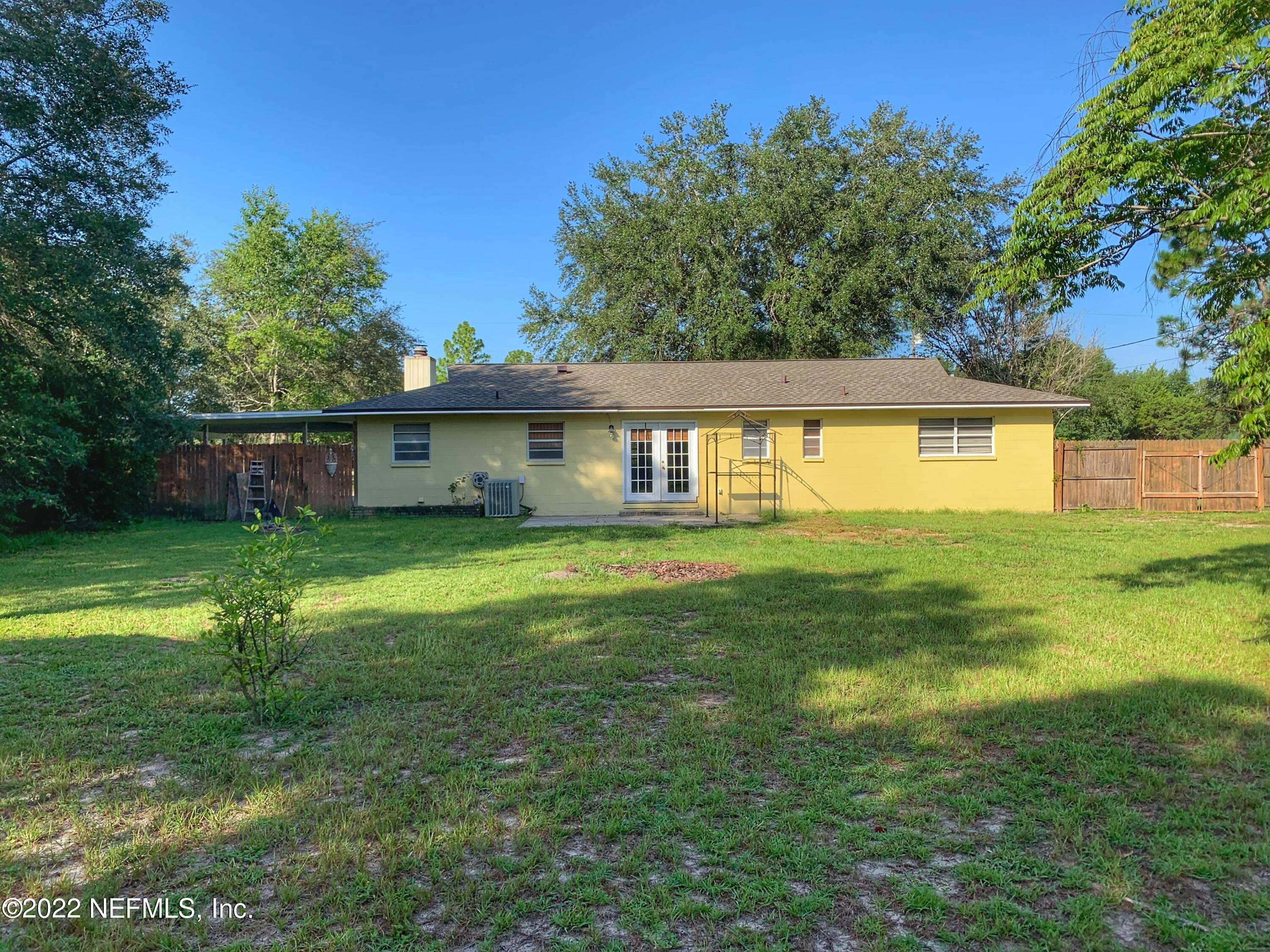 6771 Deer Springs Road Keystone Heights, FL 32656 - Photo 3 of 23 a view of a house with a backyard