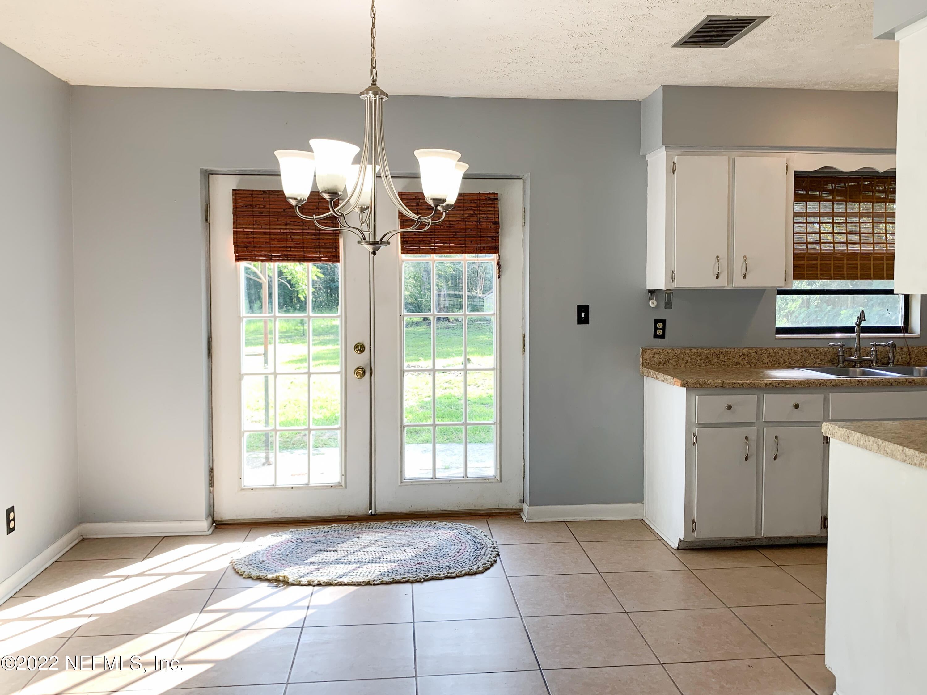 6771 Deer Springs Road Keystone Heights, FL 32656 - Photo 8 of 23 a view of kitchen with granite countertop cabinets and a sink