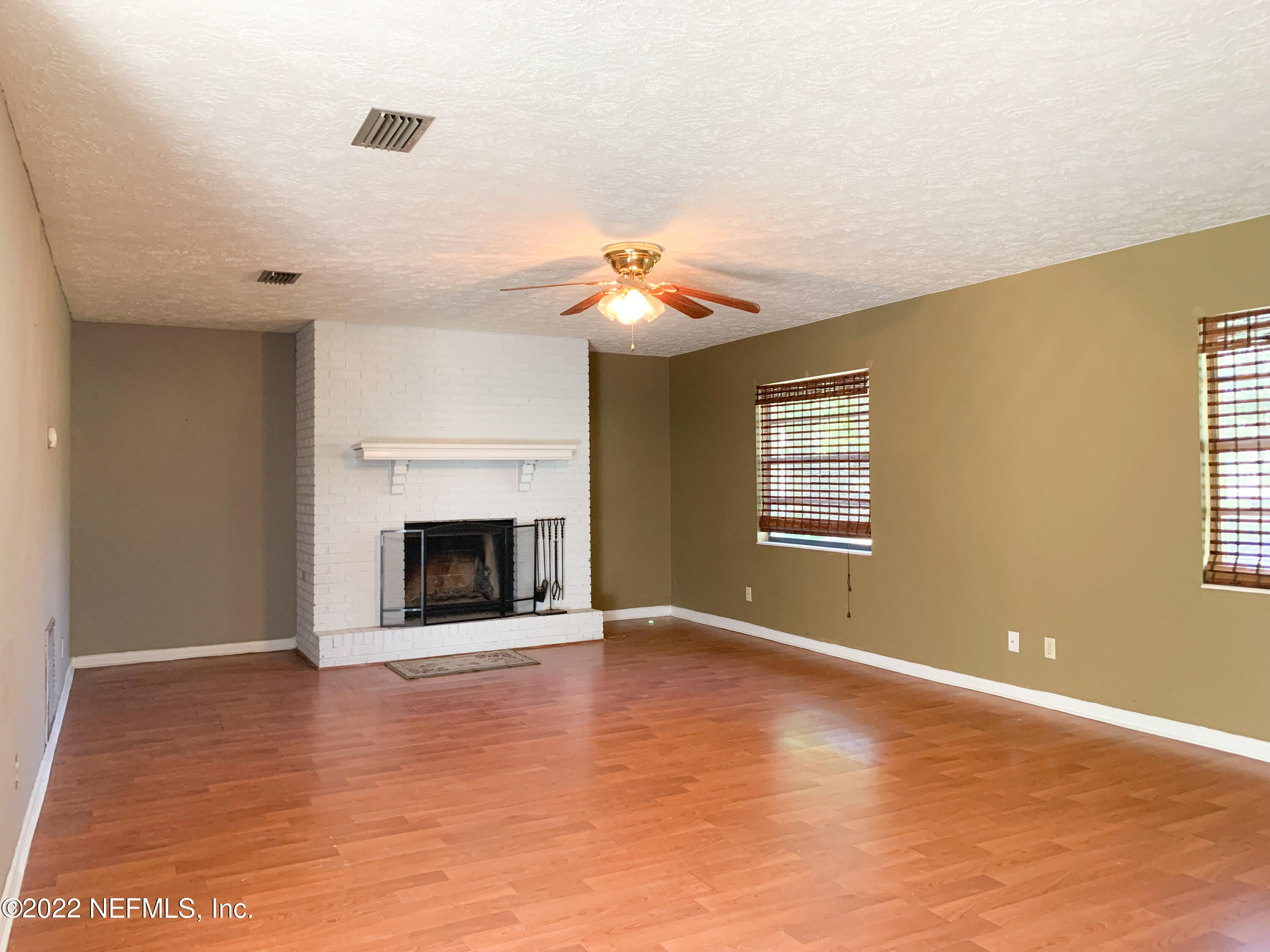 6771 Deer Springs Road Keystone Heights, FL 32656 - Photo 10 of 23 a view of a room window and fireplace