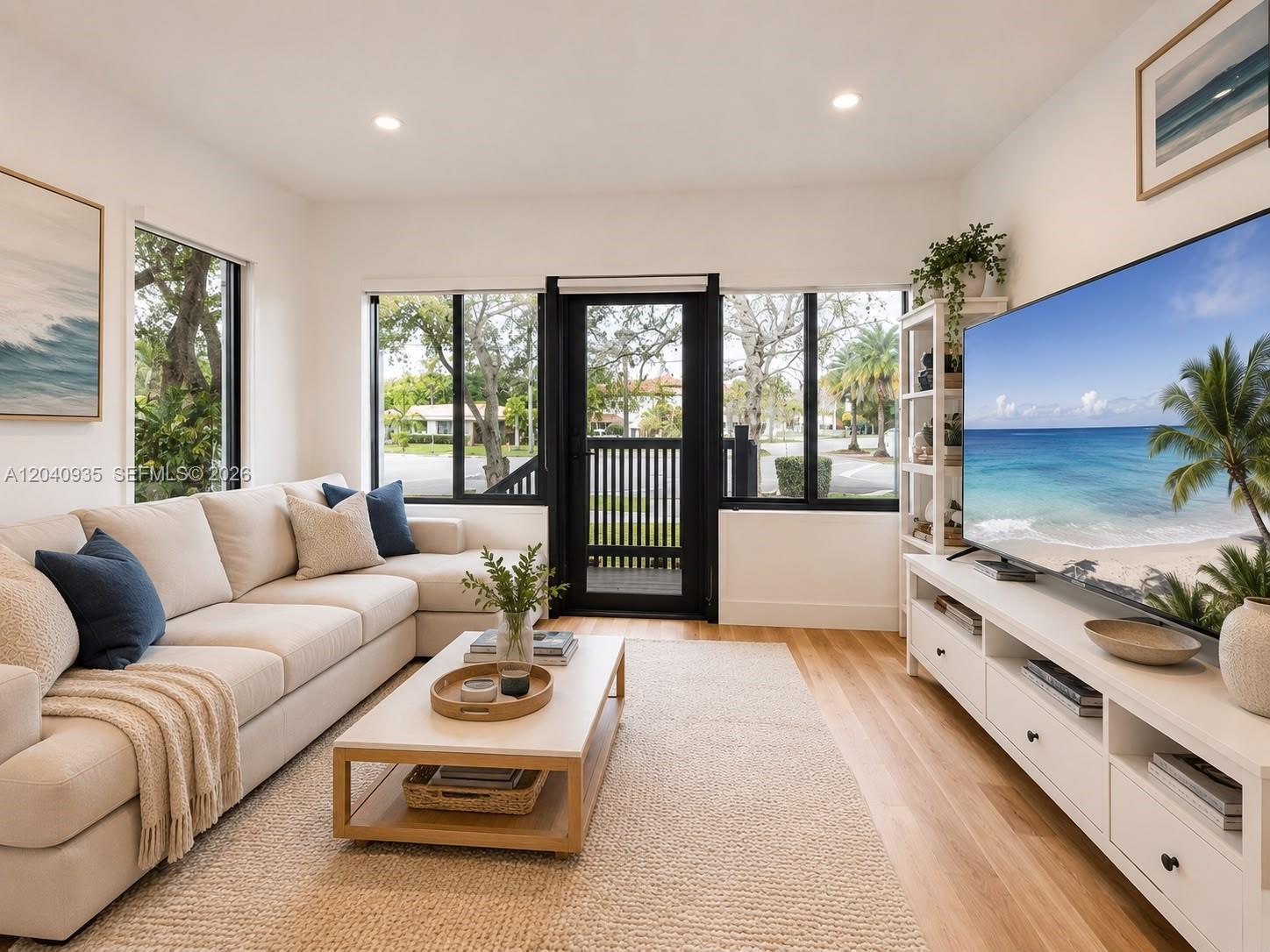 375 Southwest 32nd Road Miami, FL 33129 - Photo 4 of 44 a living room with furniture and a flat screen tv