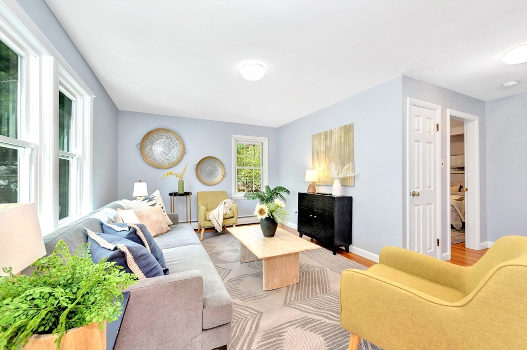 26 Andover Road Billerica, MA 01821 - Photo 11 of 40 a living room with furniture and a fireplace