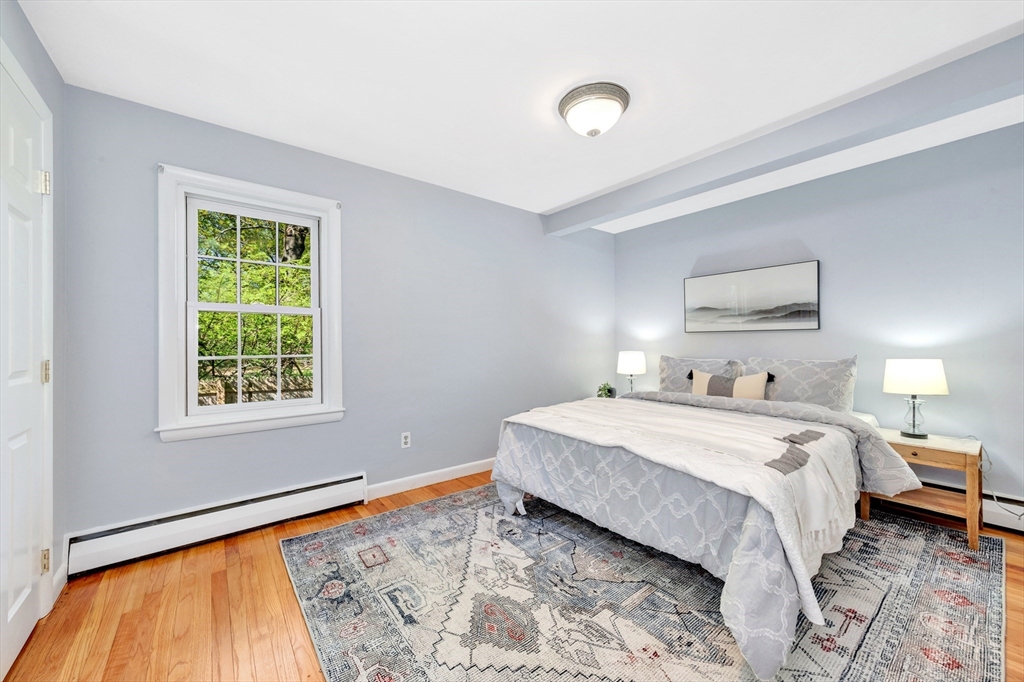 26 Andover Road Billerica, MA 01821 - Photo 15 of 40 a bedroom with a bed and a window