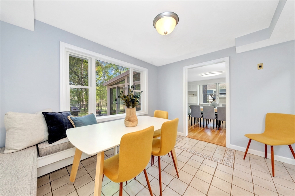 26 Andover Road Billerica, MA 01821 - Photo 25 of 40 a view of a dining room with furniture a rug and wooden floor