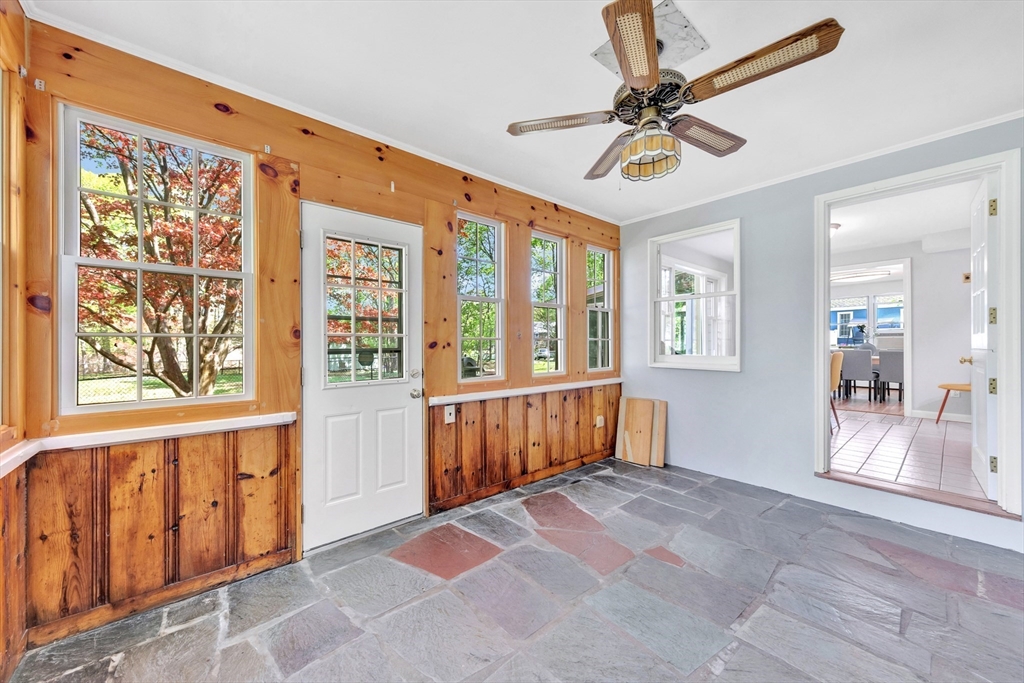 26 Andover Road Billerica, MA 01821 - Photo 31 of 40 a very nice looking room with a large window and a chandelier fan
