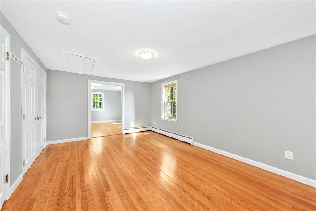 26 Andover Road Billerica, MA 01821 - Photo 32 of 40 wooden floor in an empty room with a window