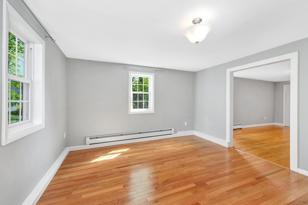 26 Andover Road Billerica, MA 01821 - Photo 33 of 40 wooden floor in an empty room with a window