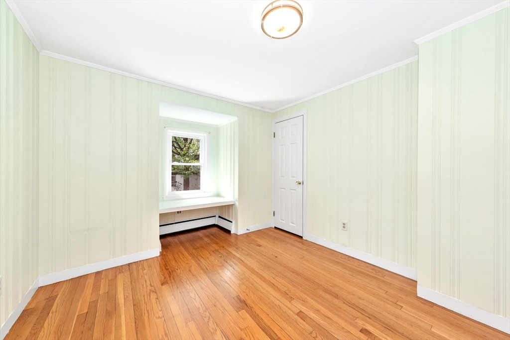 26 Andover Road Billerica, MA 01821 - Photo 35 of 40 a view of empty room with wooden floor and fan