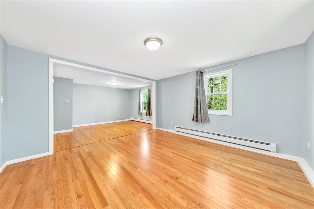 26 Andover Road Billerica, MA 01821 - Photo 37 of 40 a view of empty room with wooden floor and fan