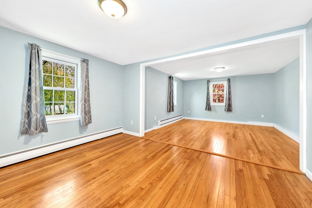 26 Andover Road Billerica, MA 01821 - Photo 38 of 40 a view of empty room with window and wooden floor