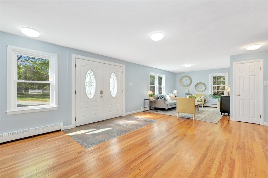 26 Andover Road Billerica, MA 01821 - Photo 9 of 40 a view of a livingroom with furniture wooden floor and window