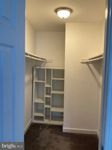 a kitchen with stainless steel appliances granite countertop a refrigerator a stove a sink and dishwasher