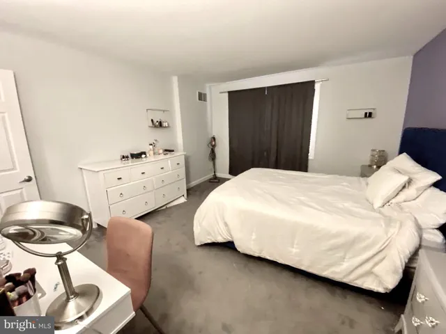 a bedroom with a bed and a closet