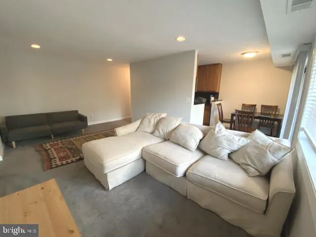 a living room with furniture and a couch