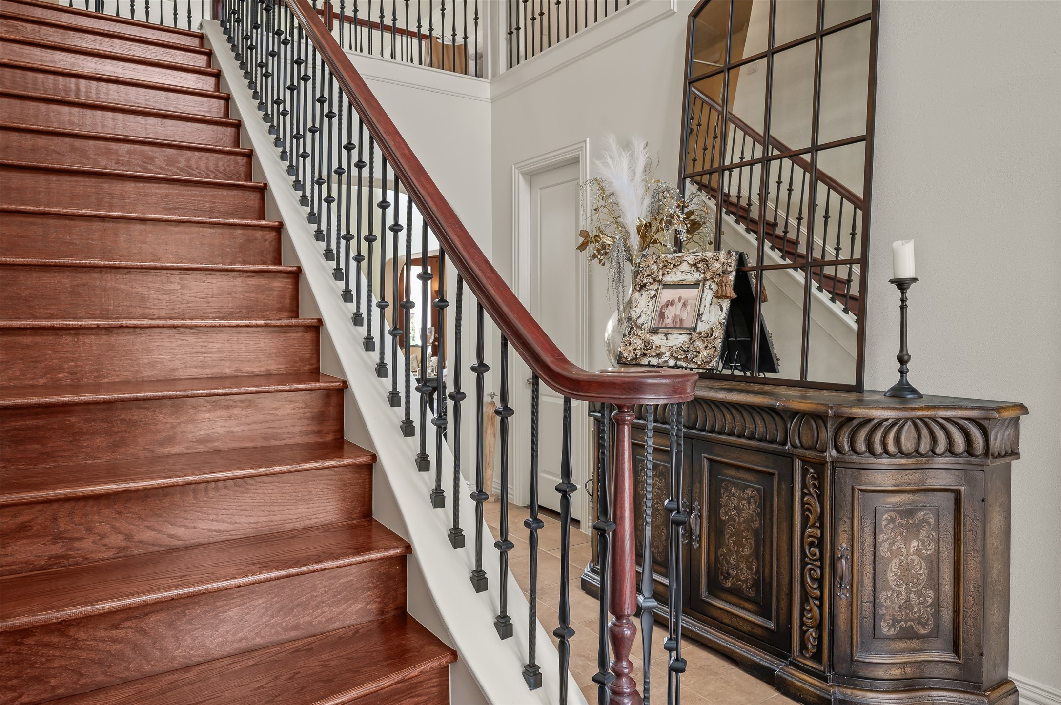 2127 Thicket Ridge Lane Houston, TX 77077 - Photo 10 of 48 The wood staircase leads from the foyer to 3 upstairs bedrooms, two baths and a separate enclosed game room.