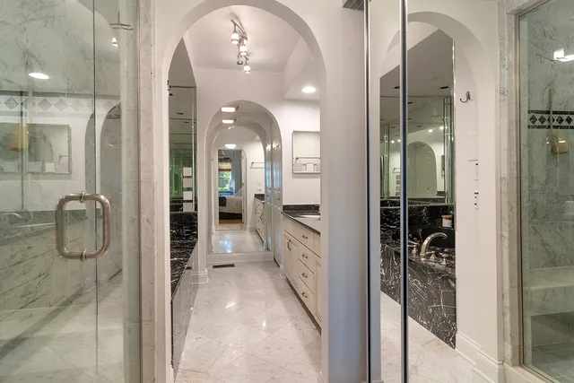 a bathroom with a glass shower door
