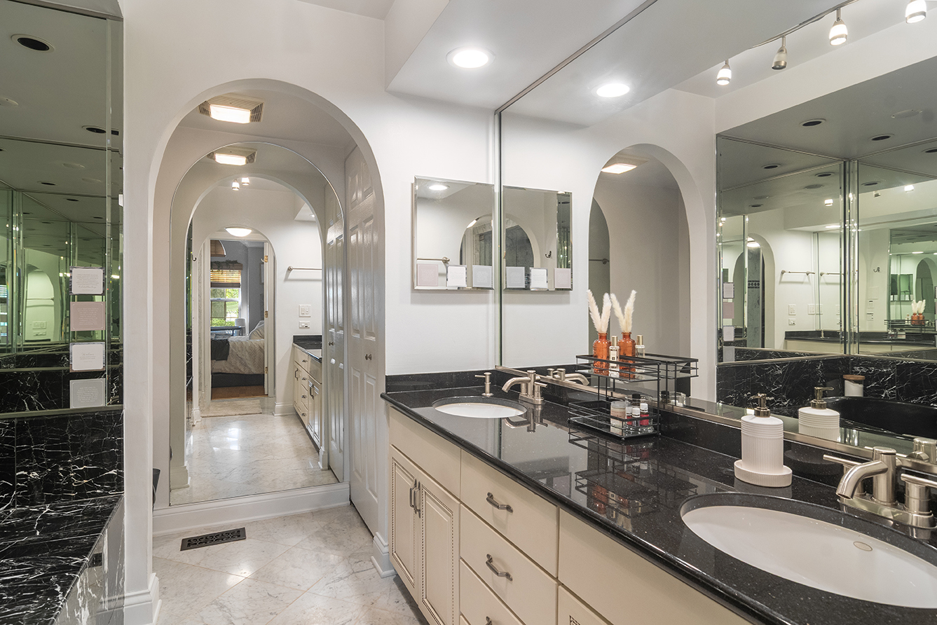 2833 Belle Lane, Unit 2833 Schaumburg, IL 60193 - Photo 13 of 23 a bathroom with a granite countertop sink a mirror and a shower