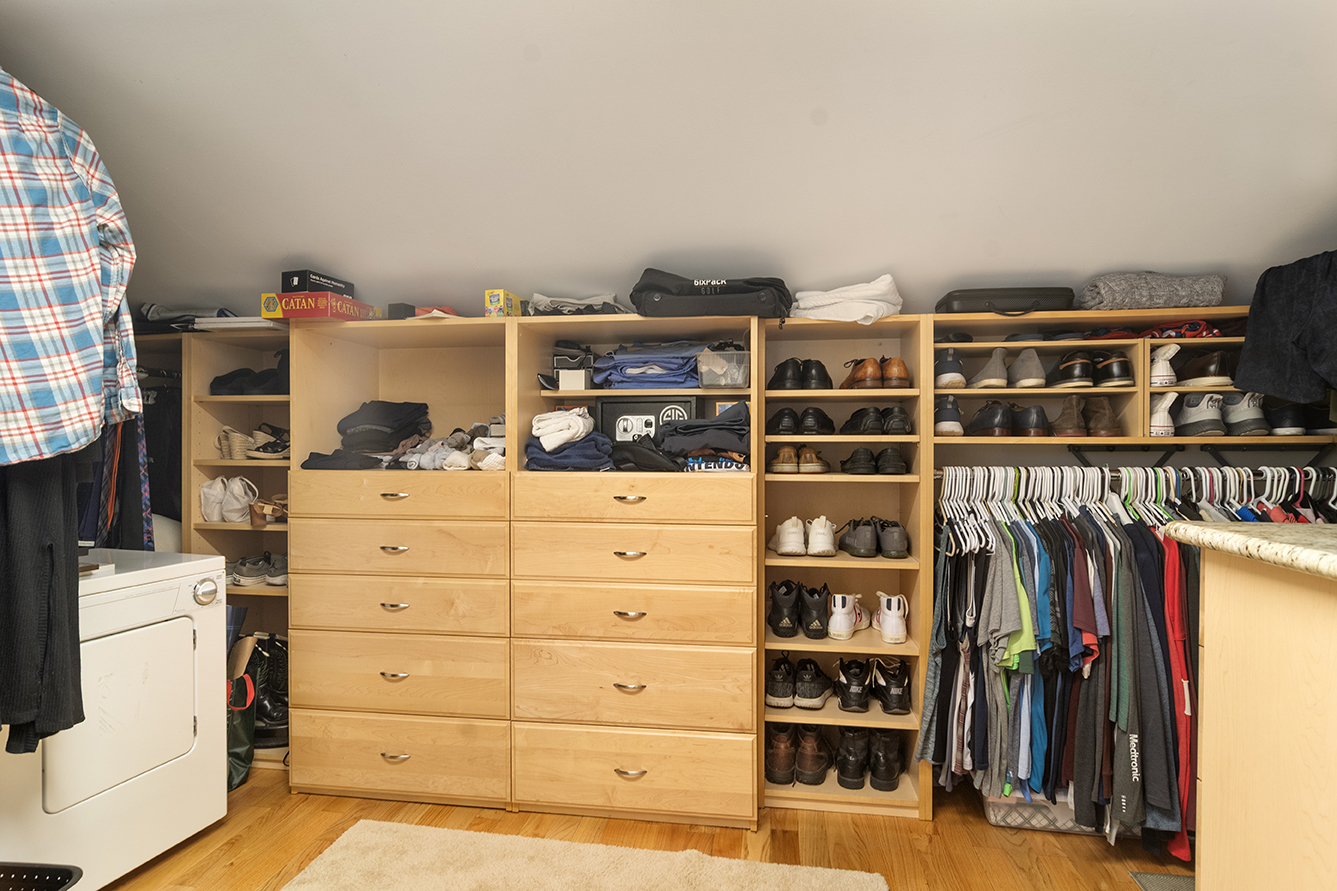 2833 Belle Lane, Unit 2833 Schaumburg, IL 60193 - Photo 17 of 23 a view of a bedroom with clothes and shoes