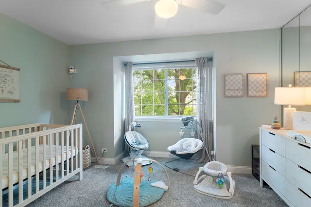 a bedroom with furniture and a window