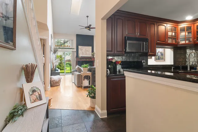 a kitchen with refrigerator and cabinets