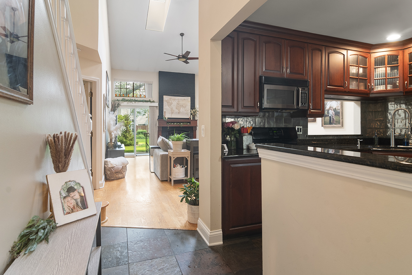 2833 Belle Lane, Unit 2833 Schaumburg, IL 60193 - Photo 3 of 23 a kitchen with refrigerator and cabinets
