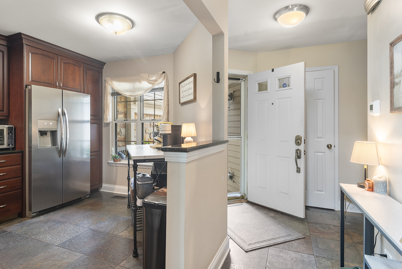 2833 Belle Lane, Unit 2833 Schaumburg, IL 60193 - Photo 4 of 23 a kitchen with a refrigerator and a sink