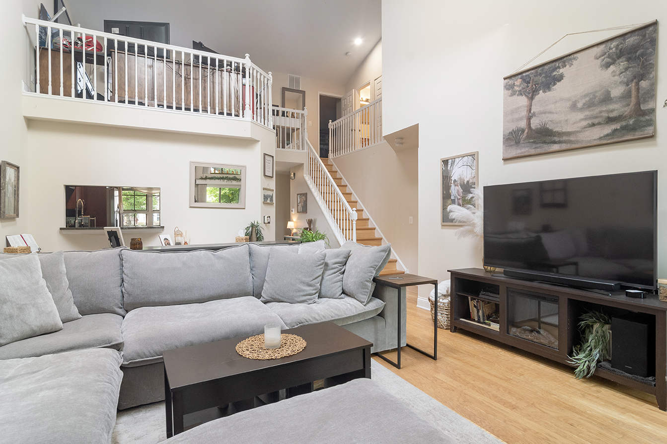 2833 Belle Lane, Unit 2833 Schaumburg, IL 60193 - Photo 10 of 23 a living room with furniture and a flat screen tv