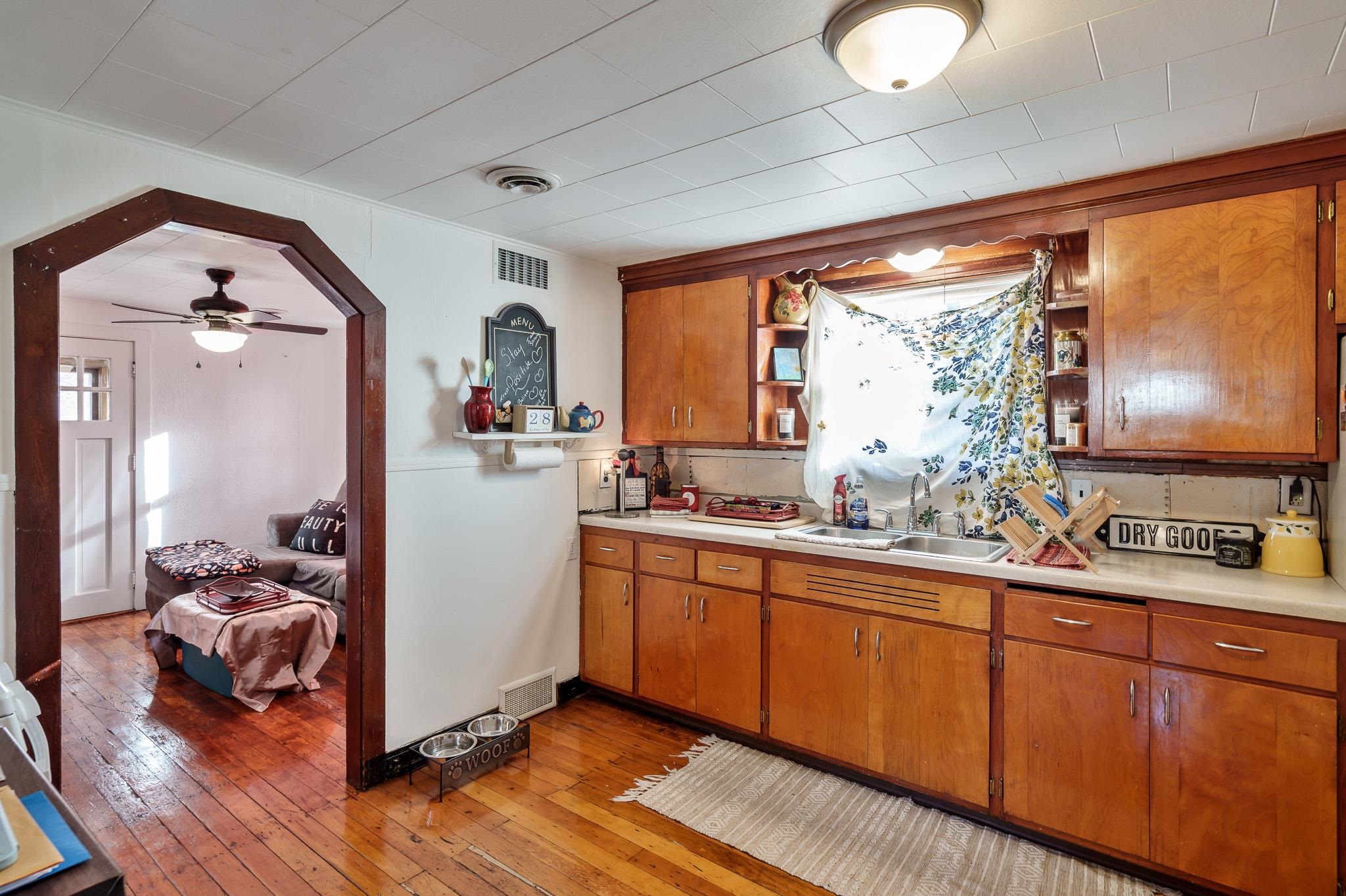 827 Sawyer Road Rockford, IL 61109 - Photo 11 of 24 a kitchen with sink refrigerator and large window