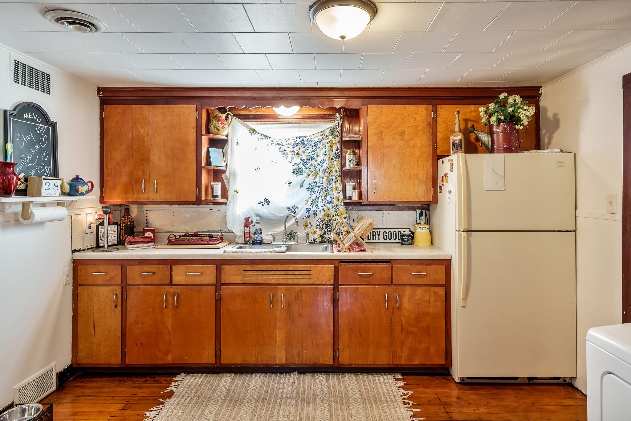 827 Sawyer Road Rockford, IL 61109 - Photo 12 of 24 a kitchen with appliances a sink and cabinets