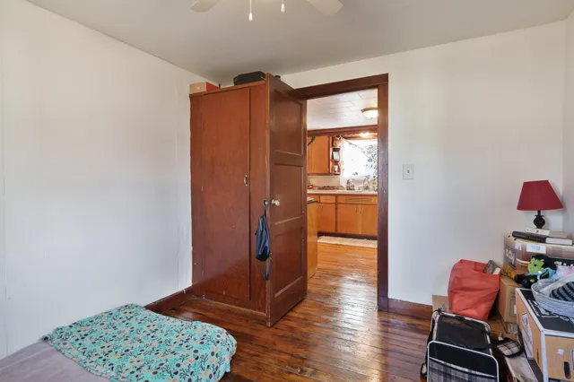 a view of room with furniture and wooden floor