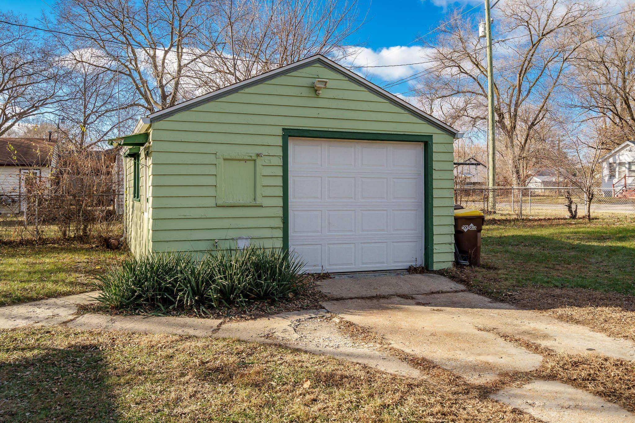 827 Sawyer Road Rockford, IL 61109 - Photo 22 of 24 a front view of a house with a yard