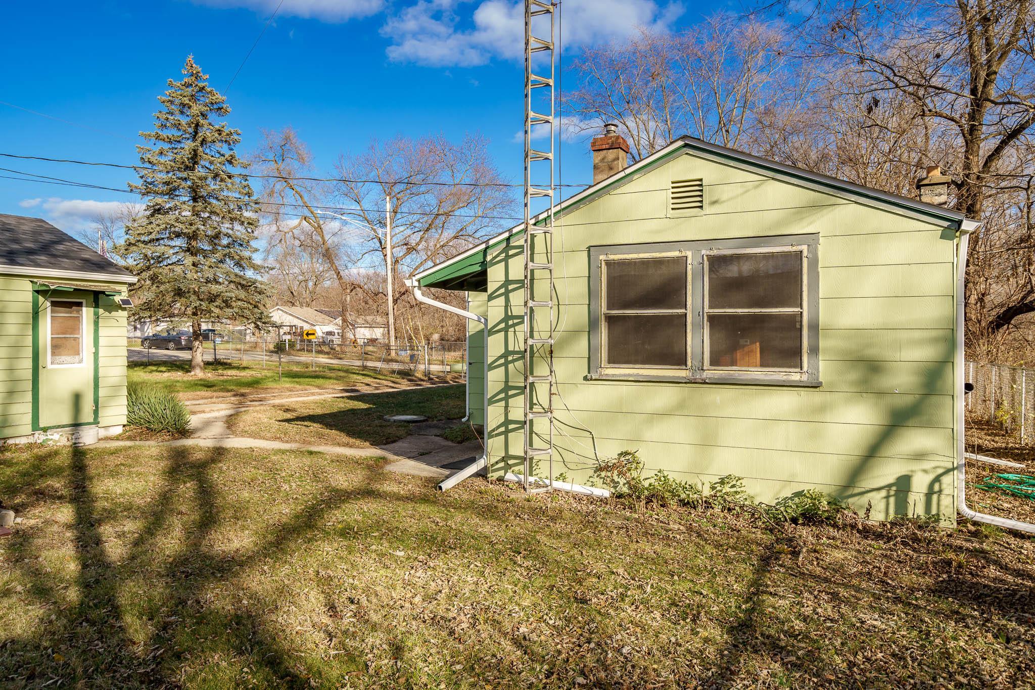 827 Sawyer Road Rockford, IL 61109 - Photo 24 of 24 a view of a brick house with large windows