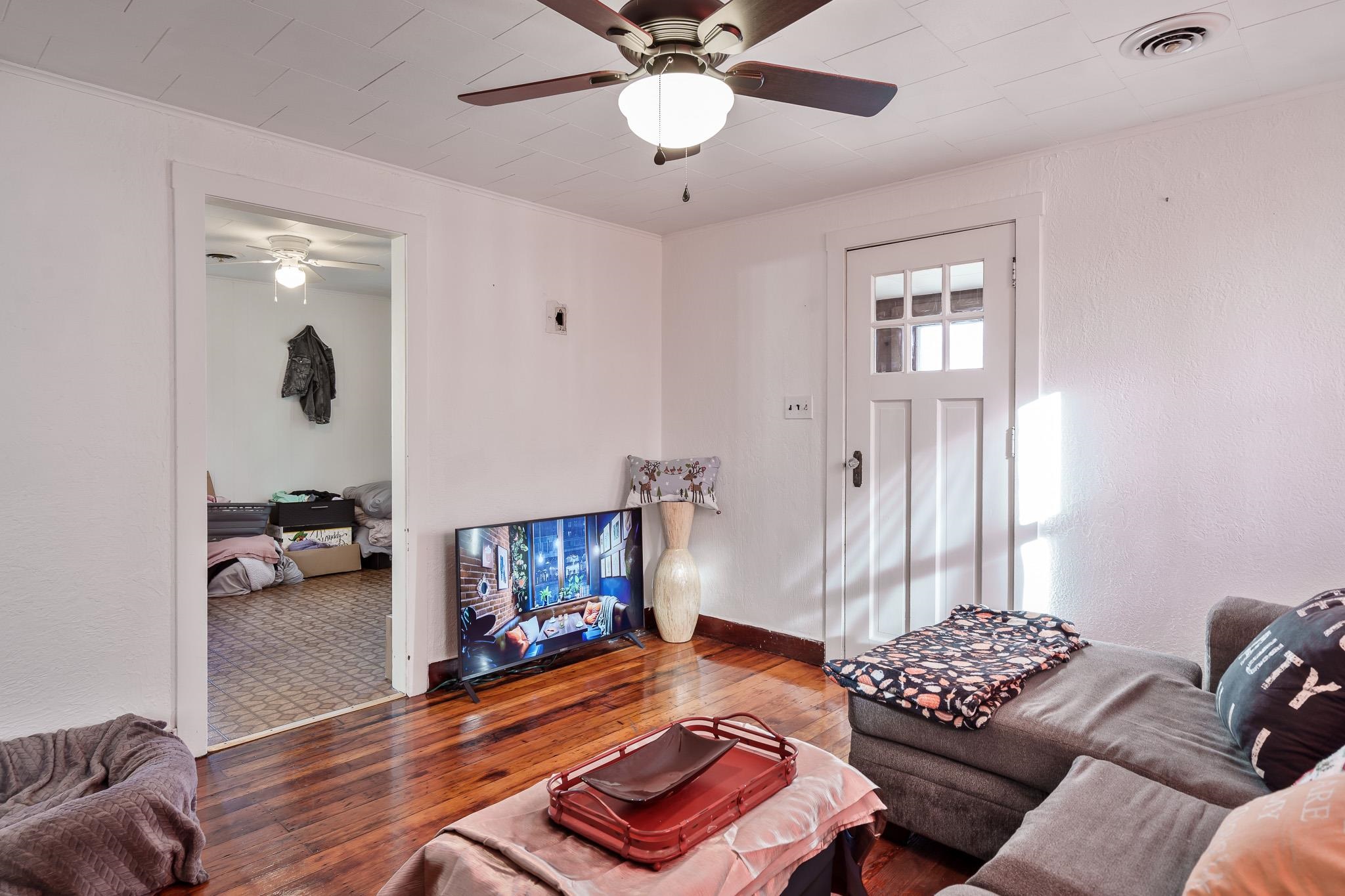 827 Sawyer Road Rockford, IL 61109 - Photo 6 of 24 a living room with furniture and a wooden floor