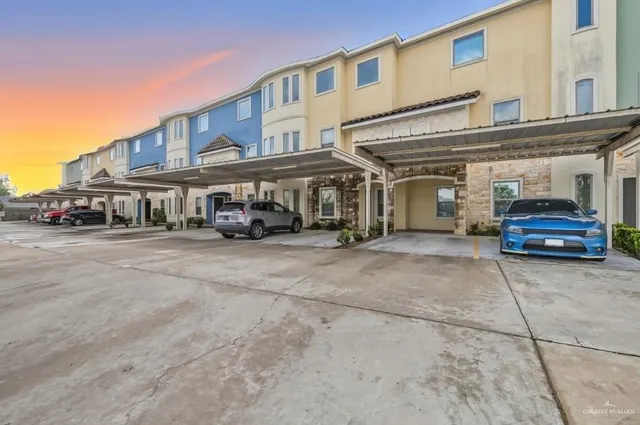 a car parked in front of a white building