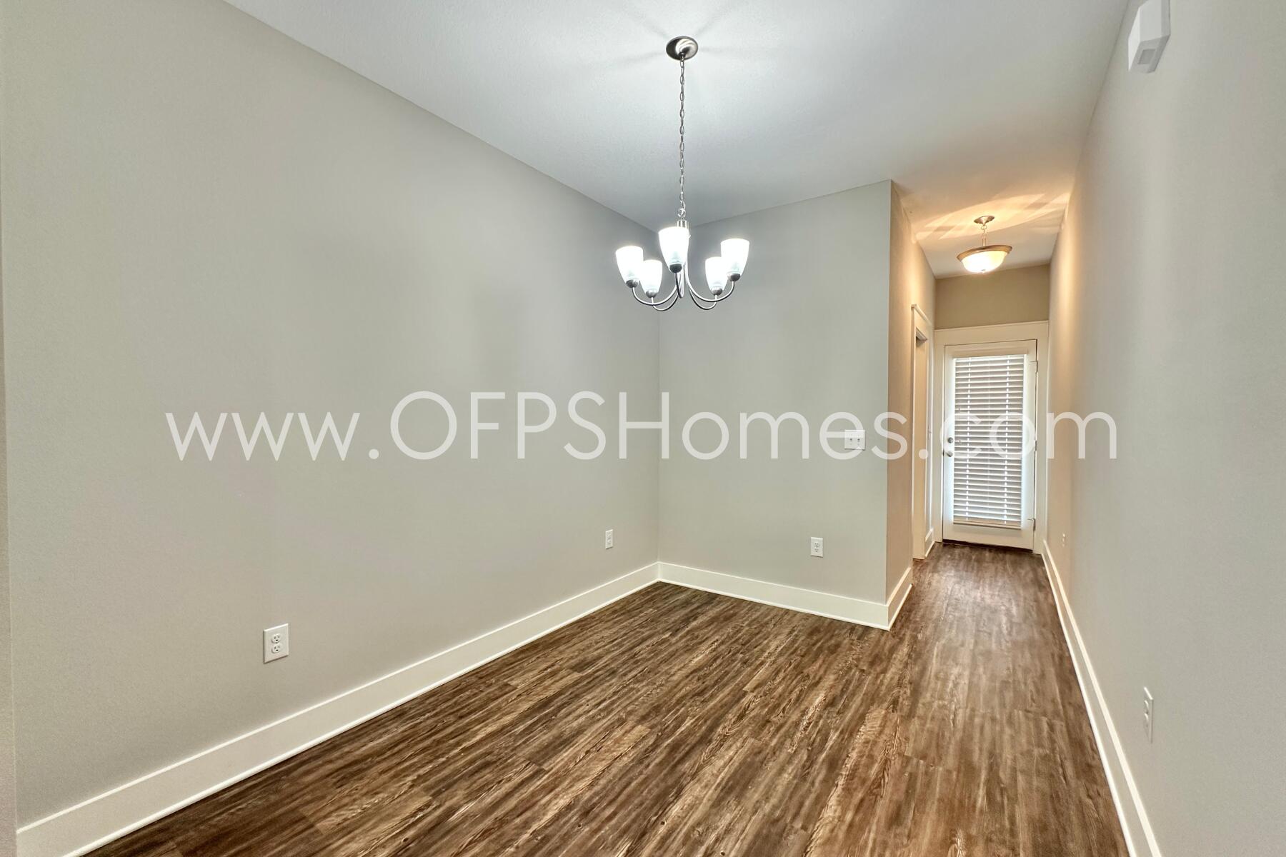 400 Mattie M Kelly Boulevard, Unit 54 Destin, FL 32541 - Photo 11 of 29 a view of wooden floor and windows in a room