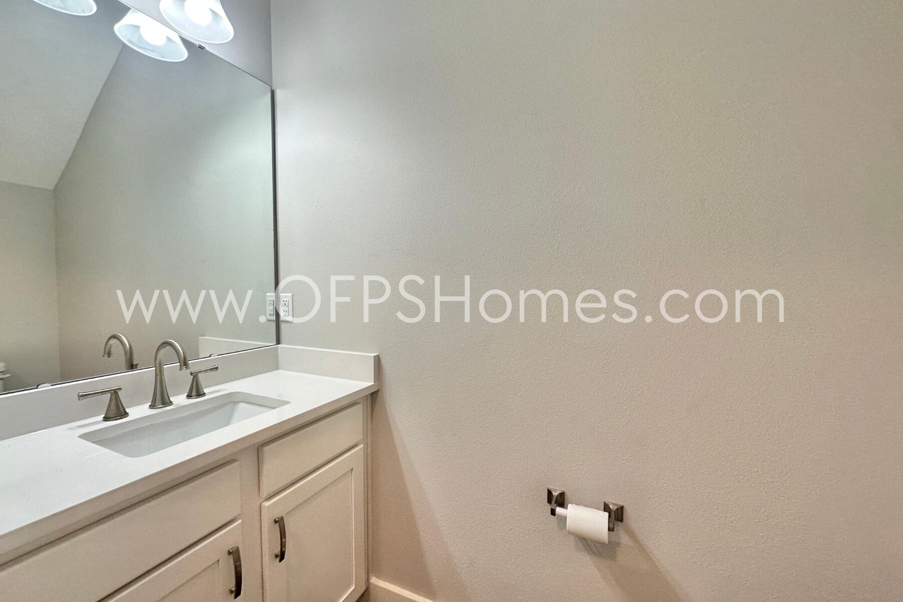 400 Mattie M Kelly Boulevard, Unit 54 Destin, FL 32541 - Photo 15 of 29 a bathroom with a sink and a mirror