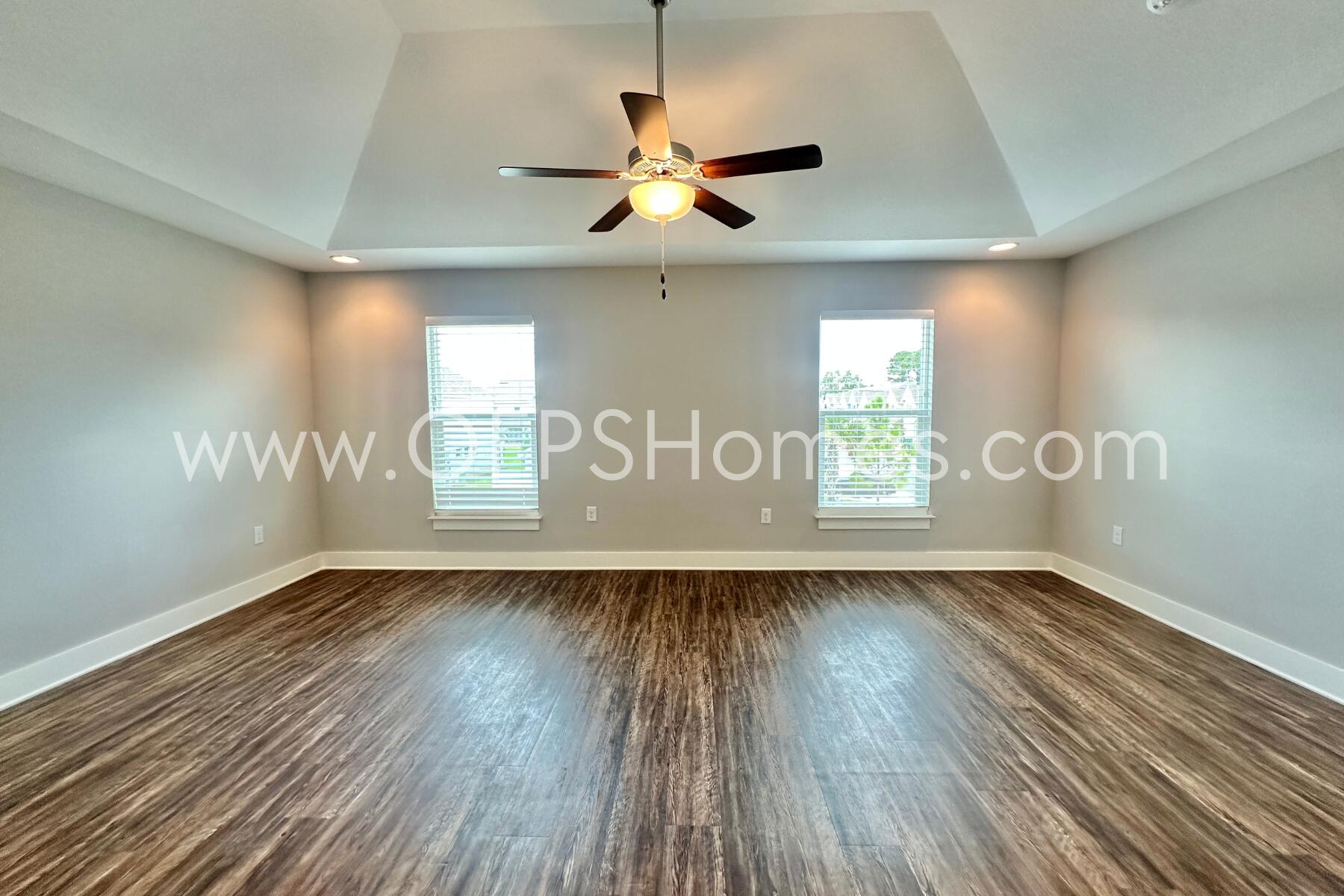 400 Mattie M Kelly Boulevard, Unit 54 Destin, FL 32541 - Photo 19 of 29 a view of an empty room with wooden floor and a window