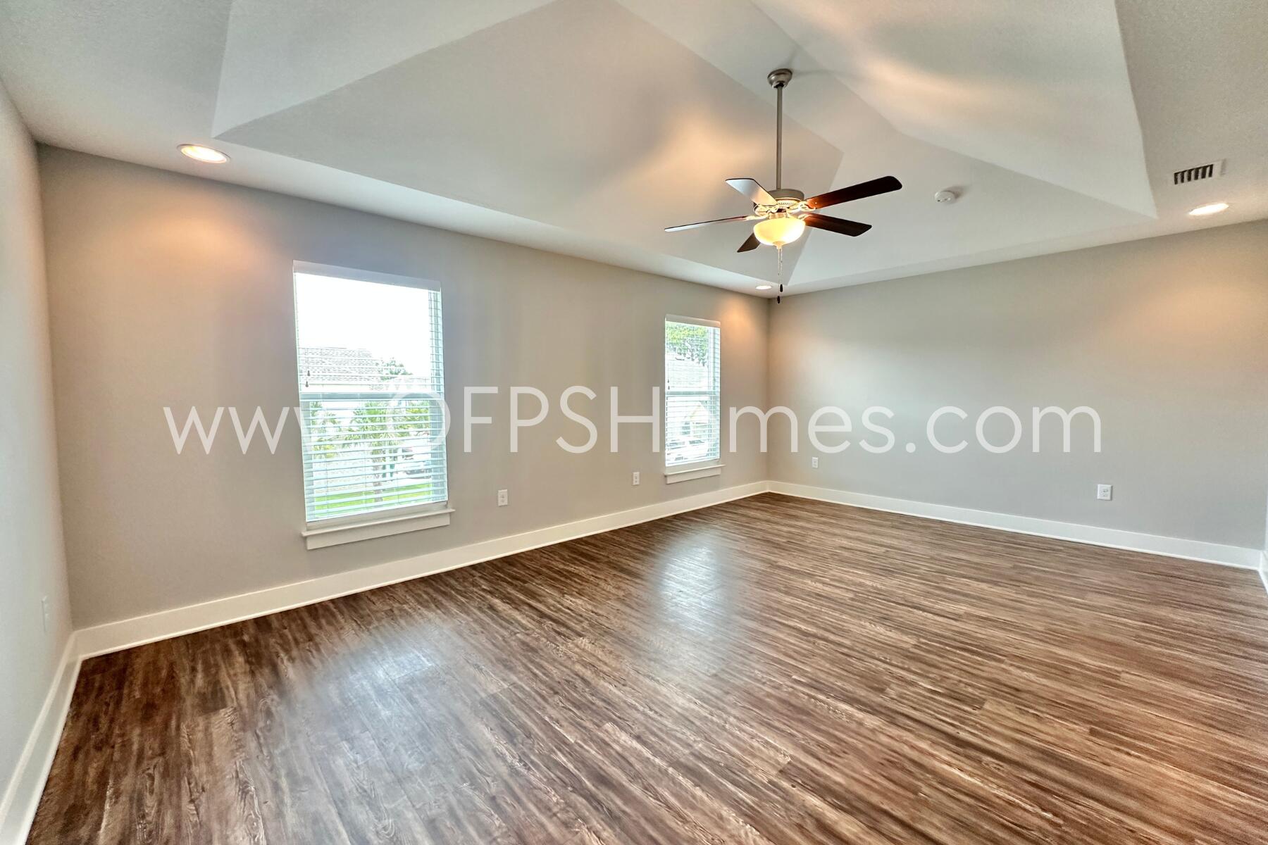 400 Mattie M Kelly Boulevard, Unit 54 Destin, FL 32541 - Photo 20 of 29 a view of an empty room with a window and wooden floor