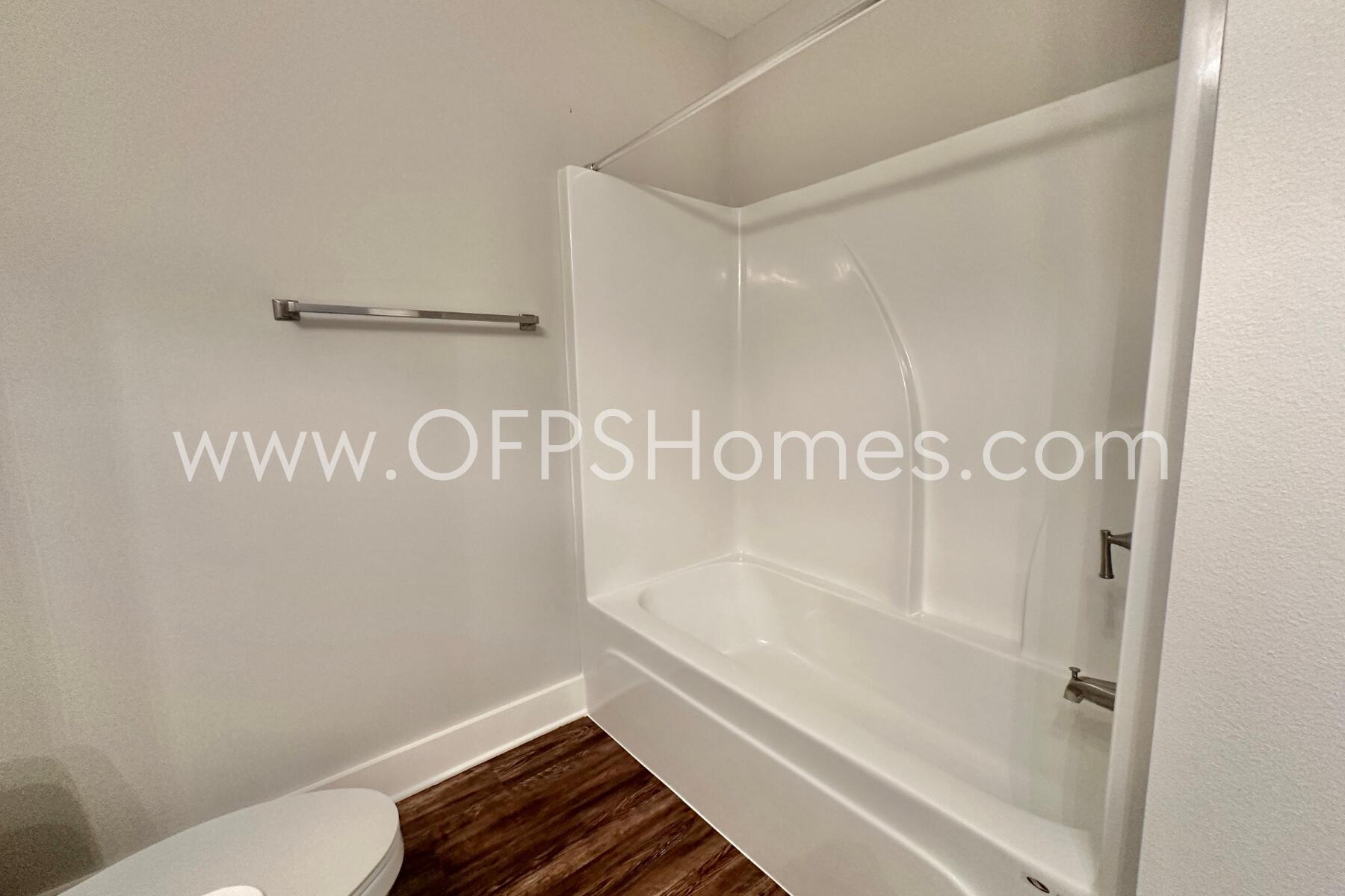 400 Mattie M Kelly Boulevard, Unit 54 Destin, FL 32541 - Photo 25 of 29 a bathroom with a bathtub and a shower