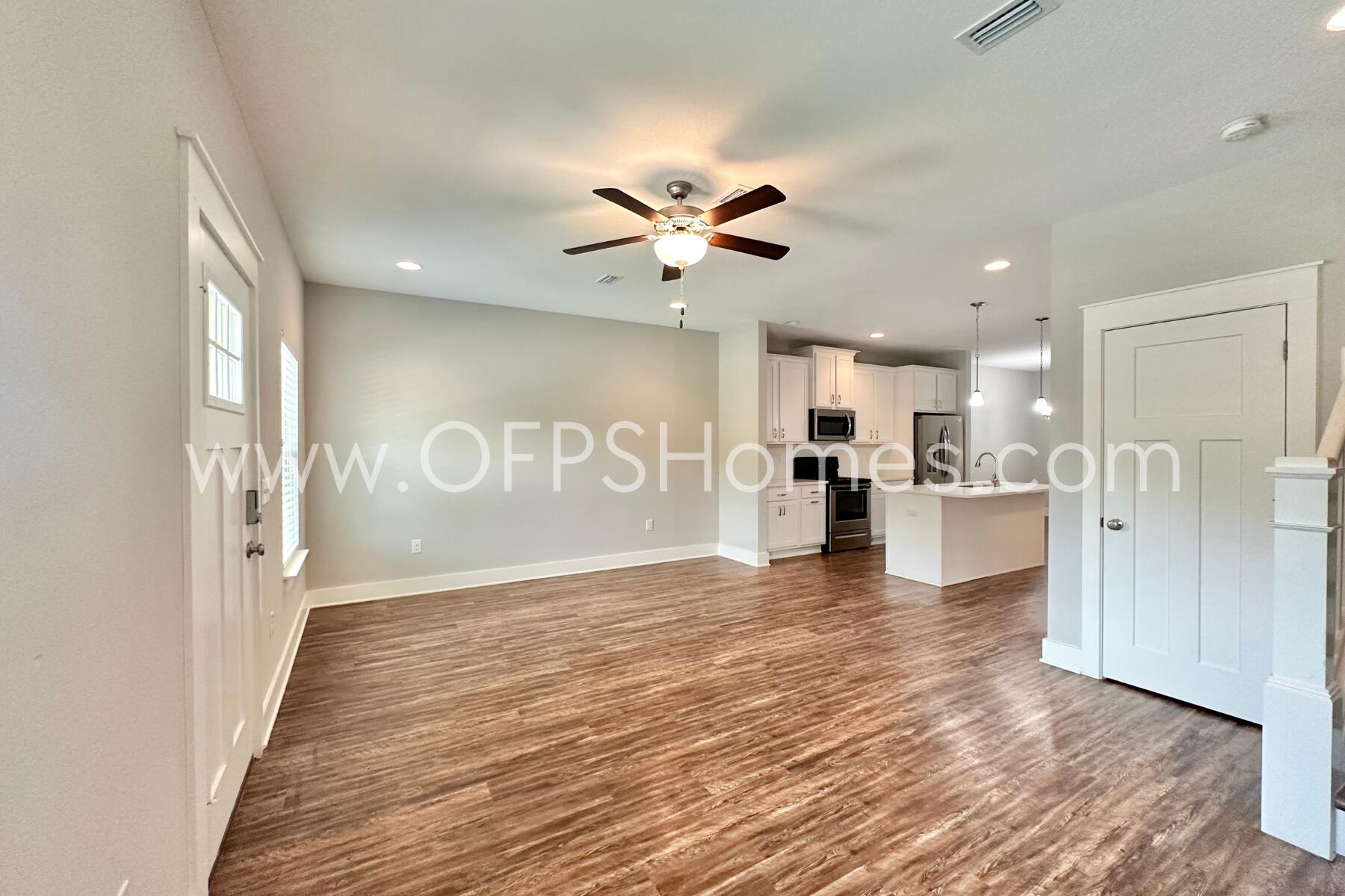 400 Mattie M Kelly Boulevard, Unit 54 Destin, FL 32541 - Photo 4 of 29 a view of a kitchen with a sink and a refrigerator