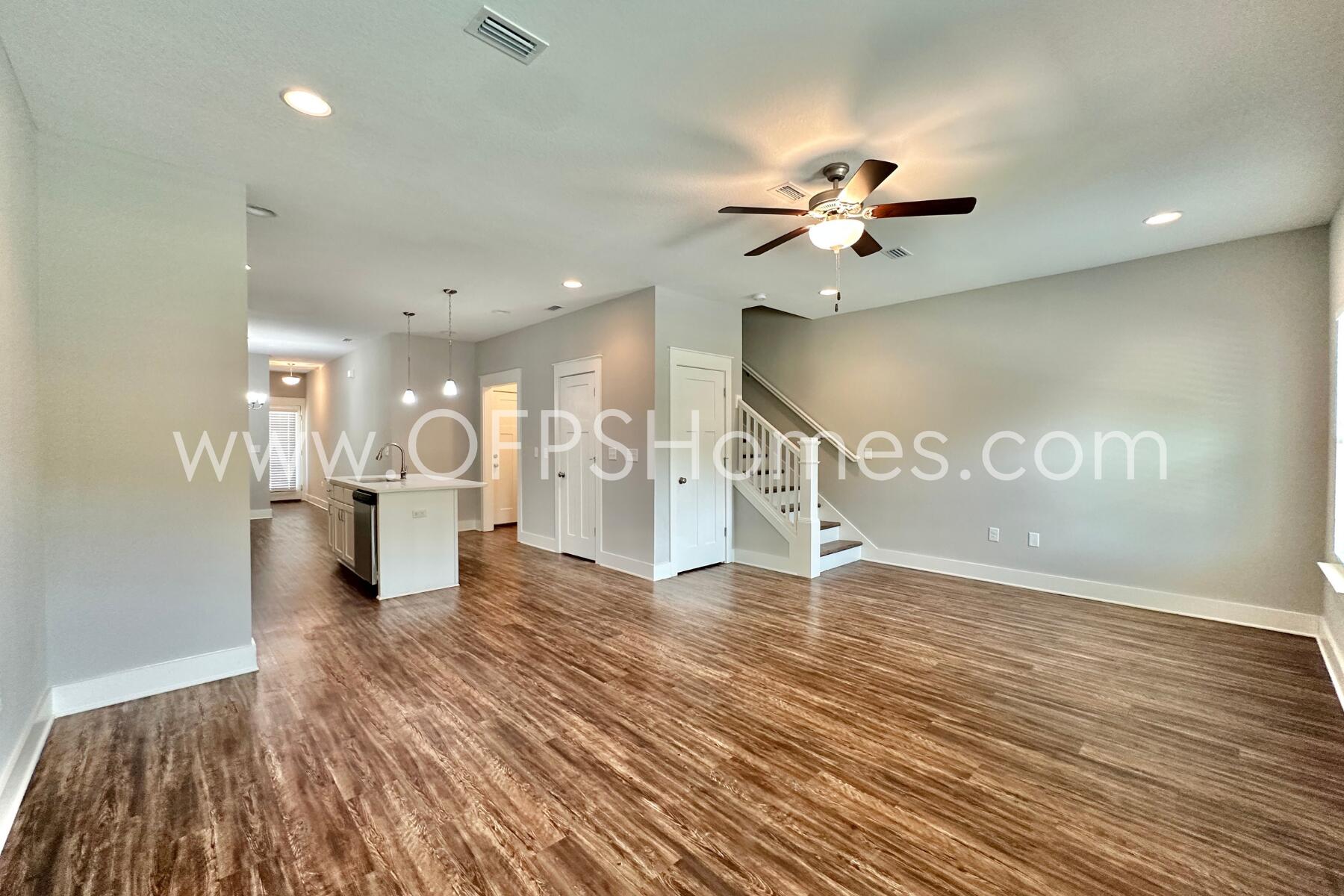 400 Mattie M Kelly Boulevard, Unit 54 Destin, FL 32541 - Photo 5 of 29 a view of a kitchen with a sink and a living room view
