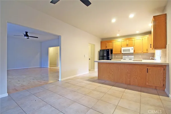 a view of a kitchen with furniture and windows
