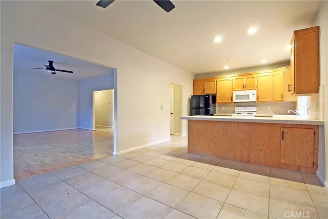 a view of a kitchen with furniture and windows