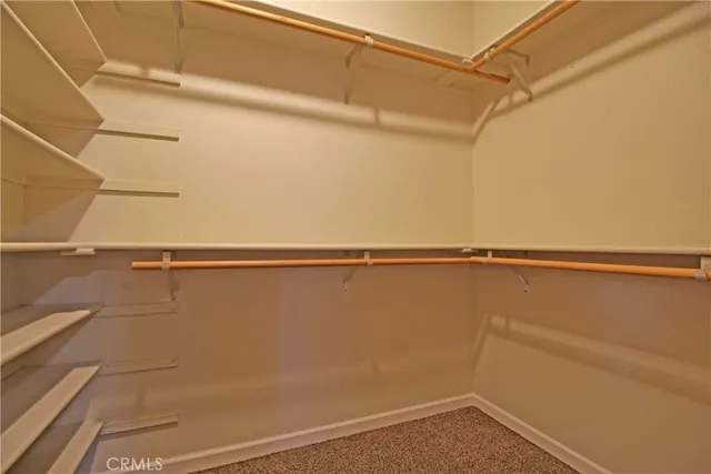 an empty room with a empty space and a ceiling fan