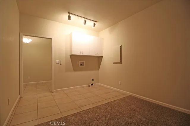 a view of an empty room with windows